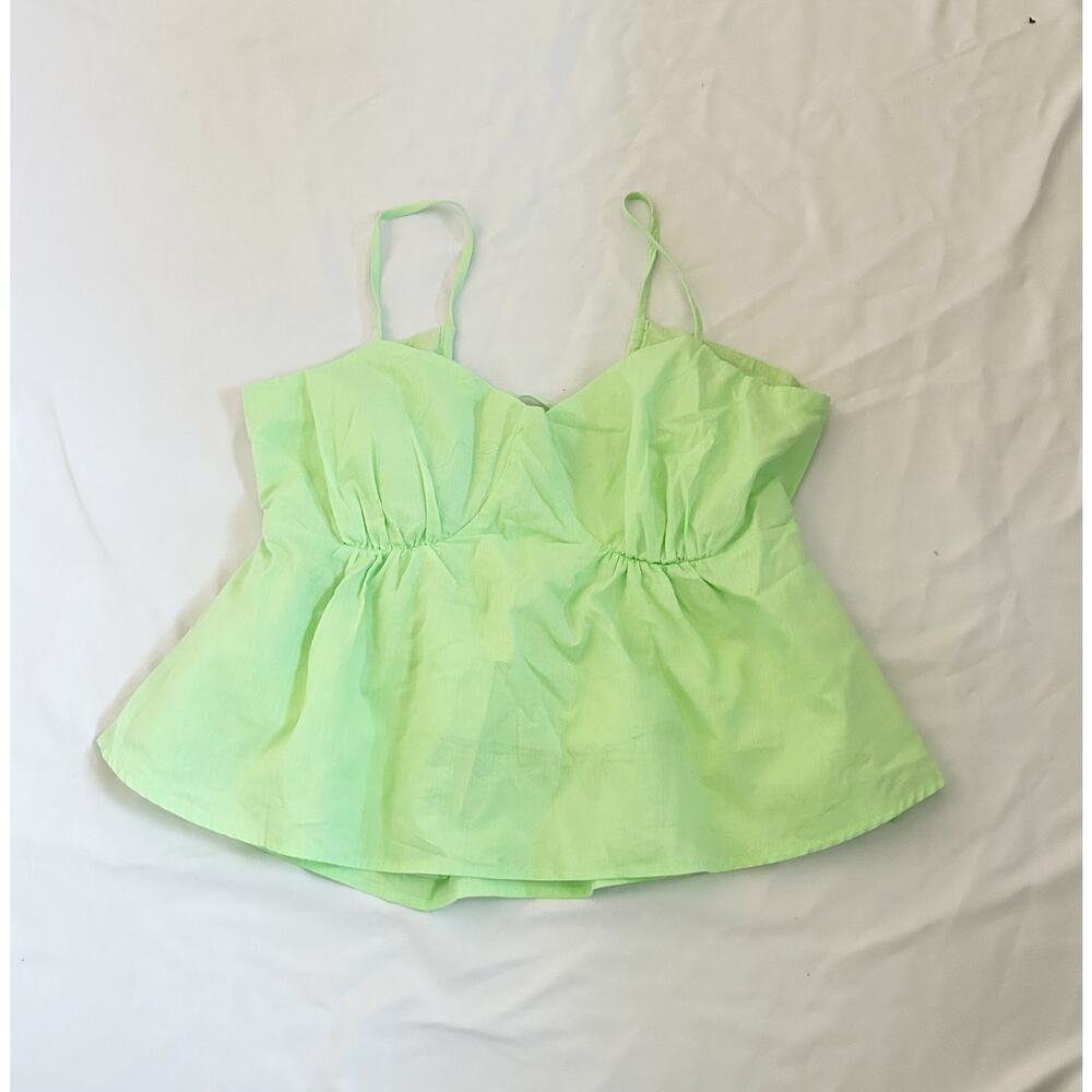 green sleeveless cotton blouse